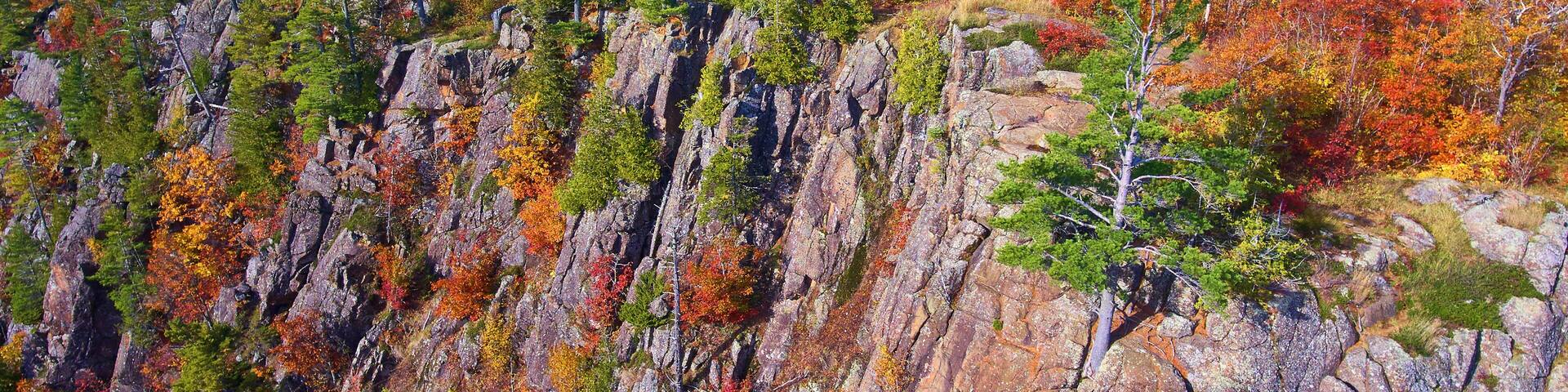 Aerial Autumn Cliffs and Foliage in Michigan Wilderness