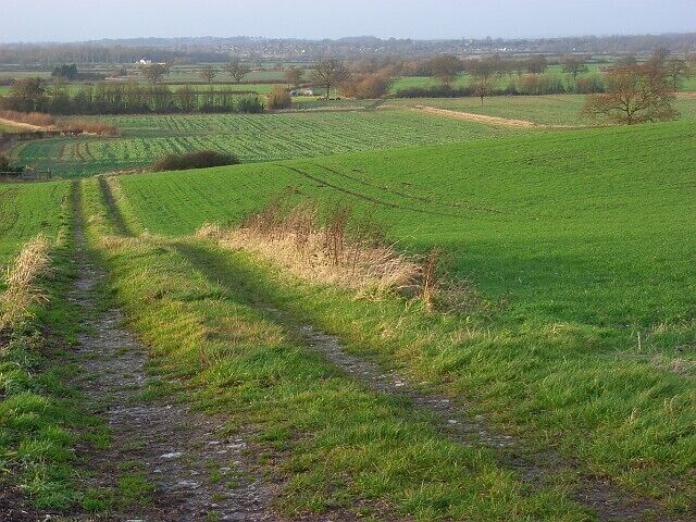 Farmland, Ashbury A track and arable land on the hillside beside the hamlet of Kingstone Winslow. Beyond is the flat expanse of the Vale of Whitehorse.