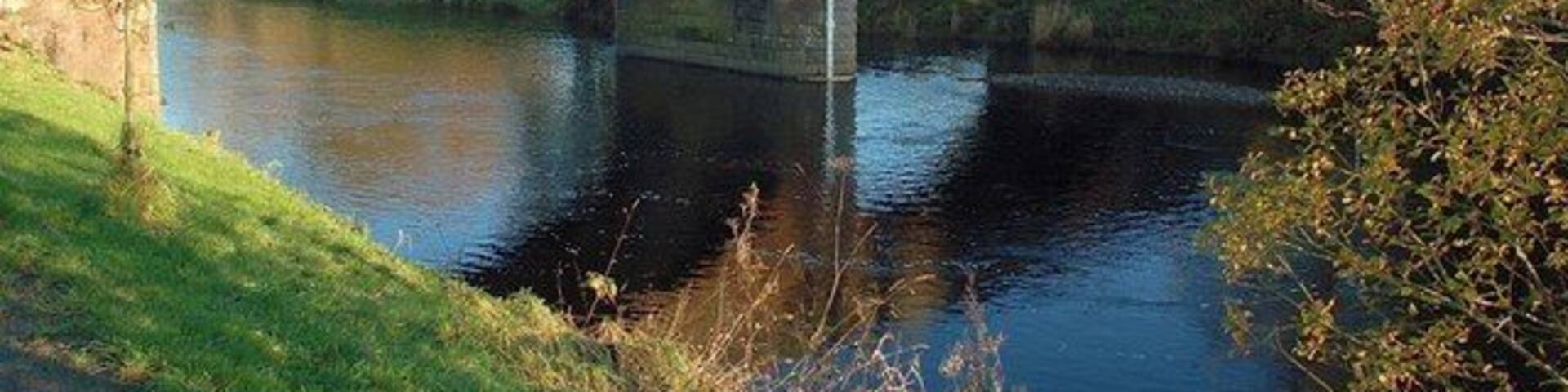 Colmonell Bridge This bridge crosses the River Stinchar, which flows from left to right in this shot. Viewed in mid-November. There's a short riverside walk on the bank in the foreground.