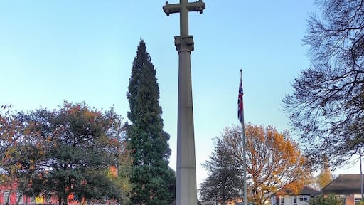 Photograph of the war memorial in the churchyard of St George's Church, Poynton, Cheshire, England