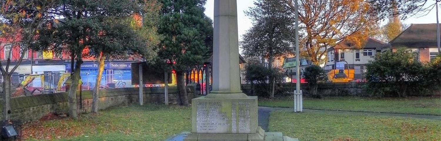 Photograph of the war memorial in the churchyard of St George's Church, Poynton, Cheshire, England