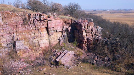 sioux quartzite cliffs and prairie surrounded by farmland at blue mounds state park of minnesota
