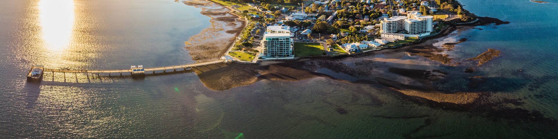 Drone view of Woody Point Jetty, a famous landmark on the Moreton Bay