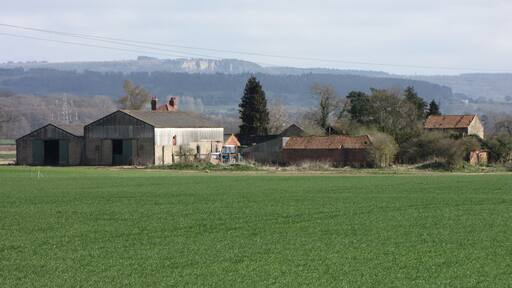 Sandholme Farm With (probably) Whitestone Cliff on the edge of the Hambleton Hills almost 6 miles distant.