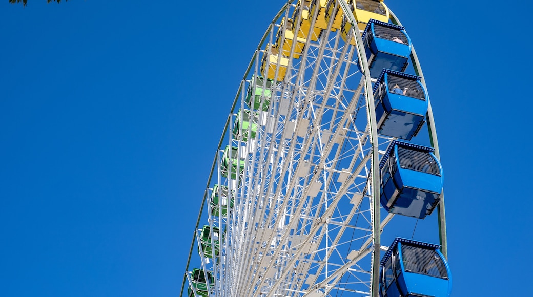 Part of a big colorful vivid ferris wheel on a bright sunny day