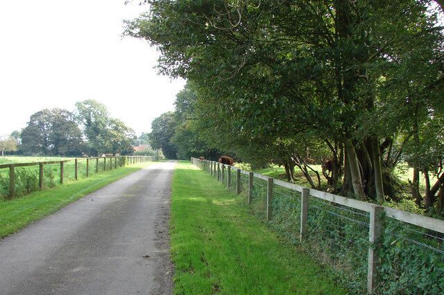 Entrance to Home Farm & West Acre Gardens Home farm is at the end of the drive on the left; High House grounds are on the right.