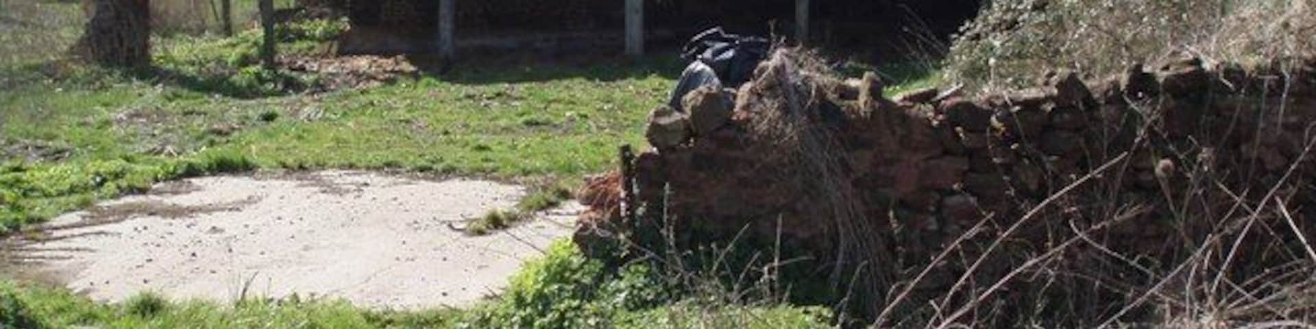 Barn. This old barn looks as though it is no longer in use, it is fenced off securely from the road.
