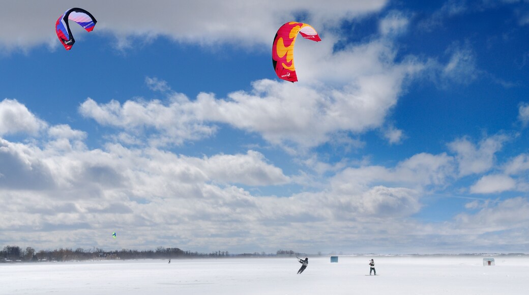 Boarder and skier snowkiting on Lake Simcoe