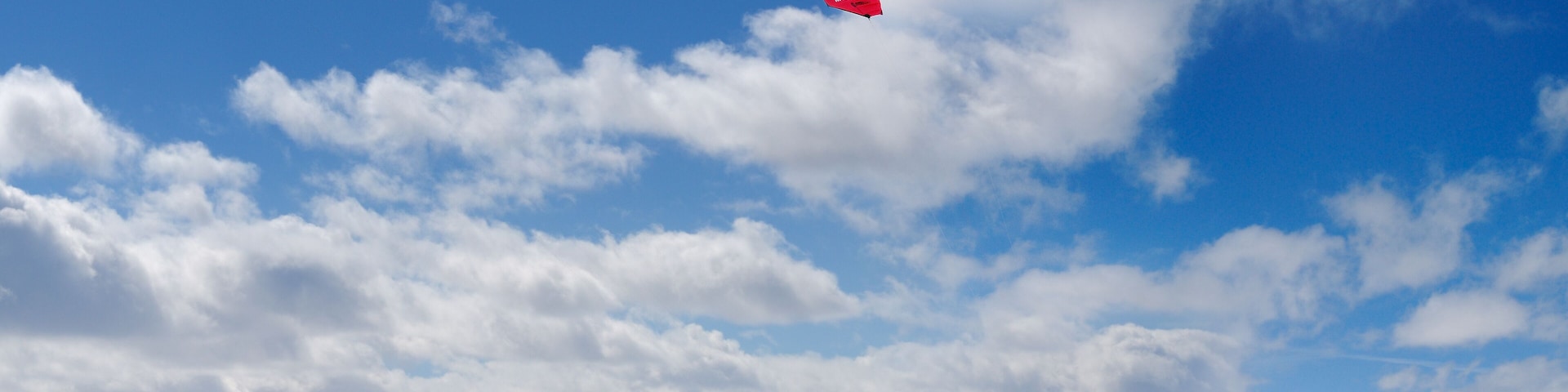Boarder and skier snowkiting on Lake Simcoe