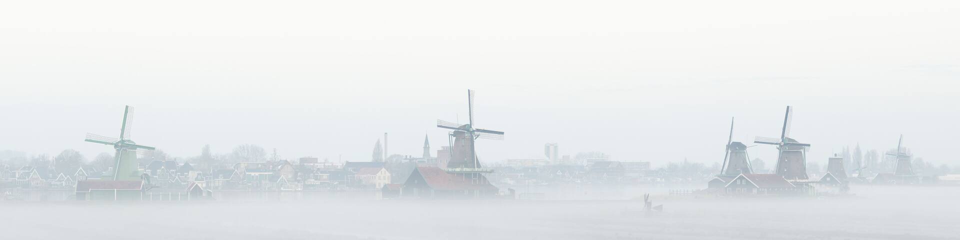Zaanse Schans windmills in the mist Netherlands Holland