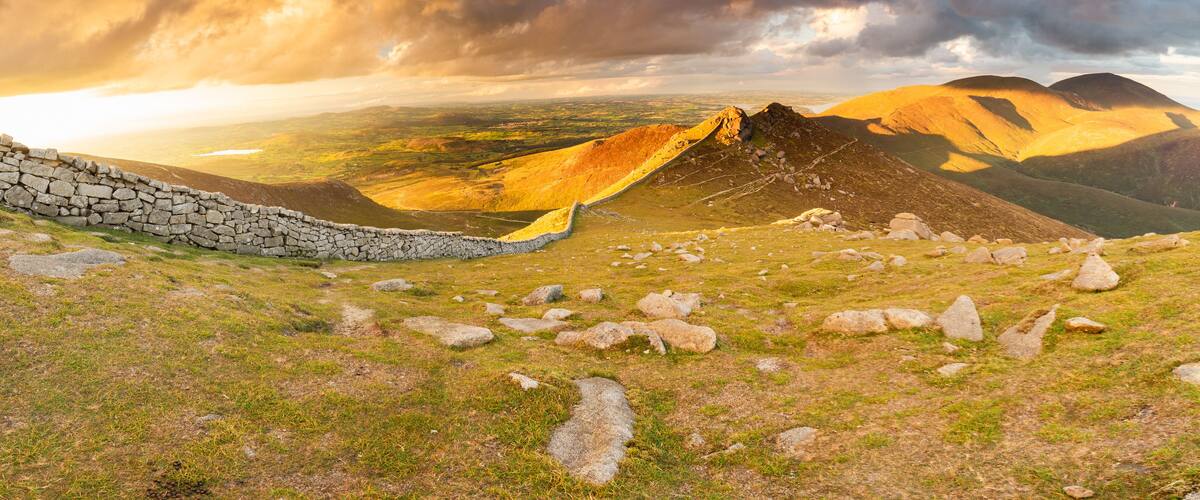 Mourne Mountains bathed in golden sunlight at sunset, Northern Ireland
