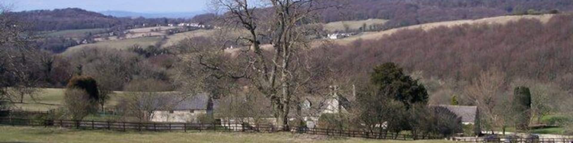 Overtown. In the south-east corner of the square. Looking north at this converted cotswold farmstead.