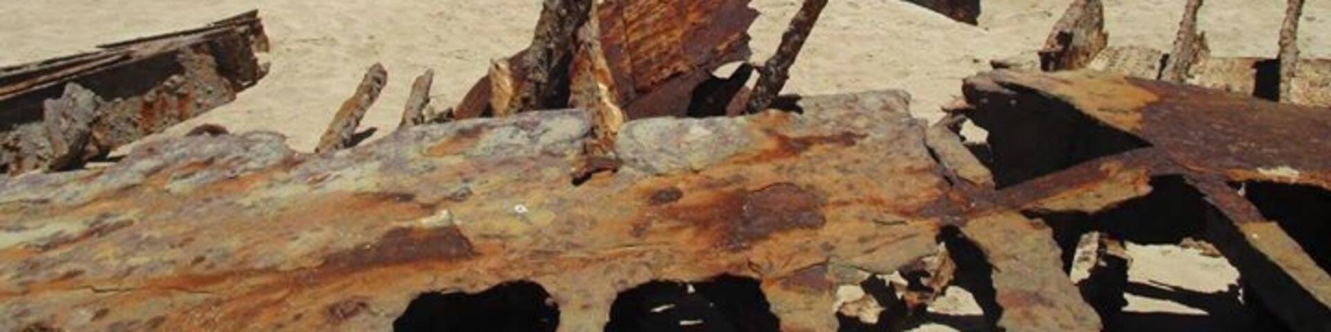 In Inneston National Park (10 dollar entry fee paid online). There is a shipwreck along one of the beaches which you can climb down to (there are stairs), to go check out. Definitely worth it to see an up close shipwreck.