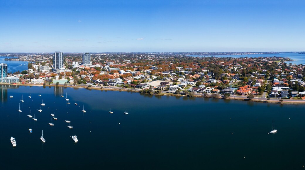 Panorama aerial view of Applecross with Canning Bridge, Yacht club and the mouth of the Canning River in the Swan River. On the horizon Perth CBD and South Perth. WA, Australia