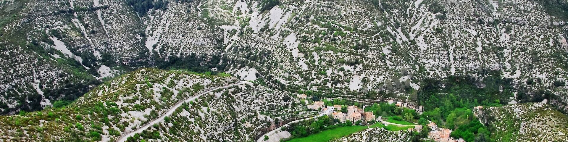 This stunning location is one of the deepest valleys in Europe. You can see the road leading down and it zig-zags up the other side. There's a small village at the bottom but there's a cafe on one lookout that has a wonderful view over this scene. Definitely worth a look if you're in the area.