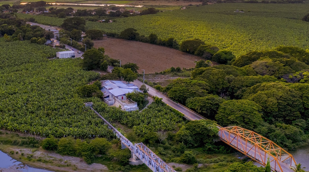 Bridges over a river surrounded by greenery during the sunrise in Mao, the Dominican Republic