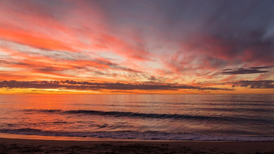 Colourful cloudy calm sunset at Bunbury, Western Australia