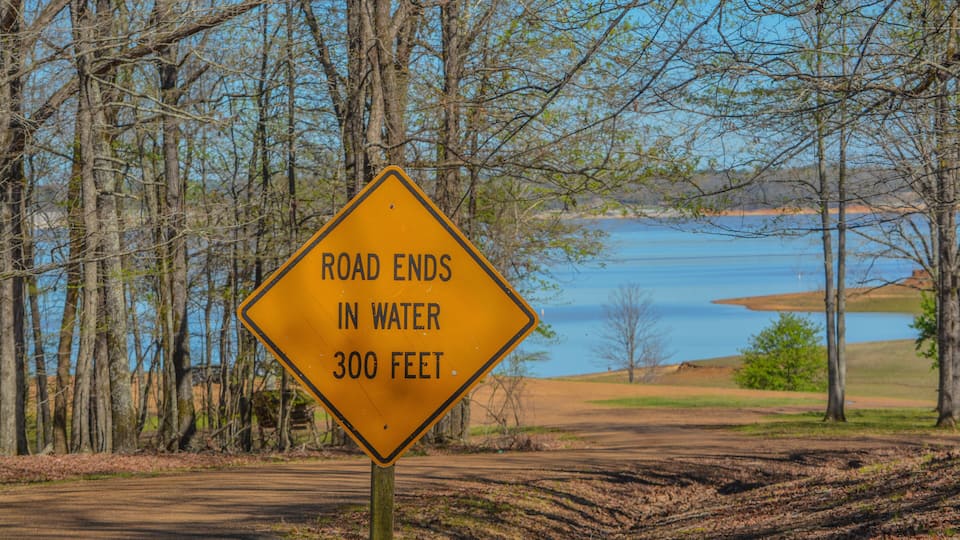 Road ends in water waning sign. At Enid Lake in Oakland, Mississippi