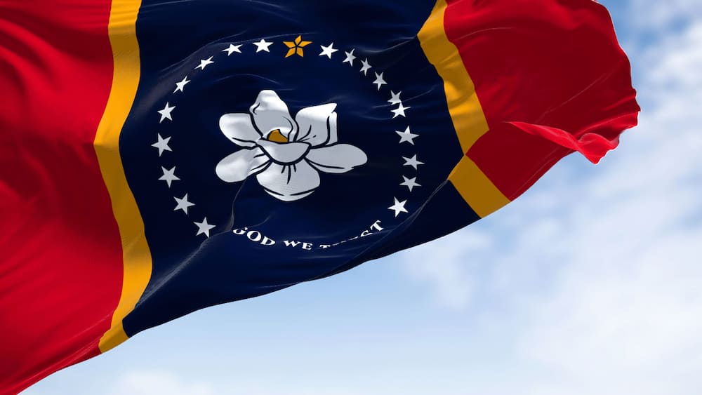 The US state flag of Mississippi waving in the wind