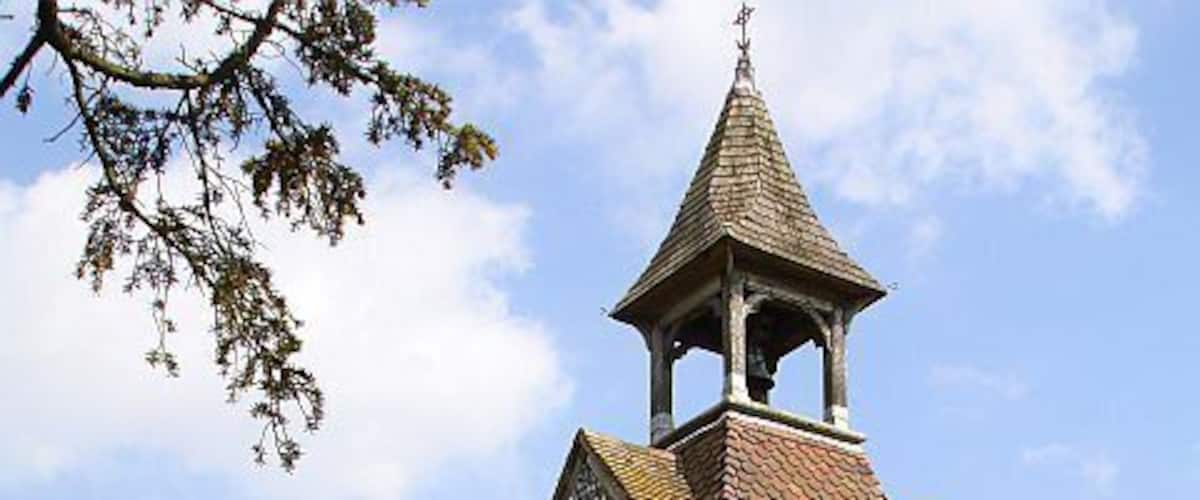 St Laurence, Leaveland West end and belfry. There was a nest of masonry bees in the flint wall on the left and several bees inside the north chapel.