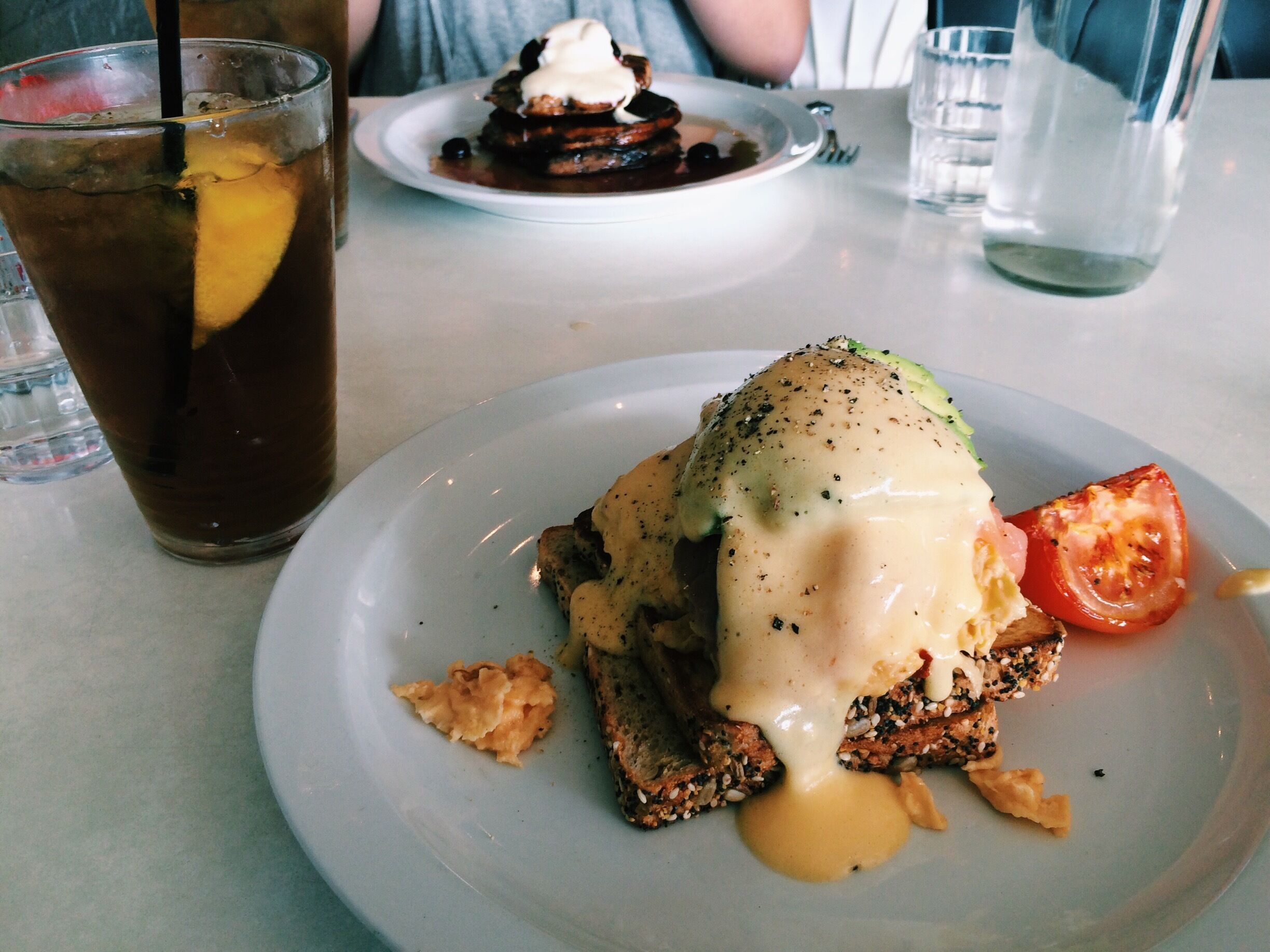 Ice lemon tea and salmon hollandaise avo