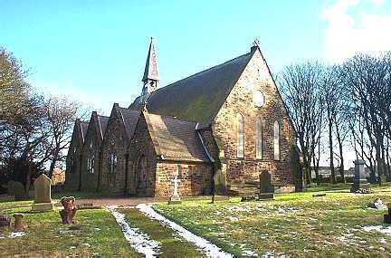 A church with a steeple, surrounded by a cemetery with headstones.
