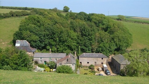 Shute Farm, South Milton. In a little valley on the northern edge of the village - tempting place to stay http://www.naturesouthwest.co.uk/main/en/acm-provider-2237.html . Seen from the footpath off the track to Sandheap Cross.