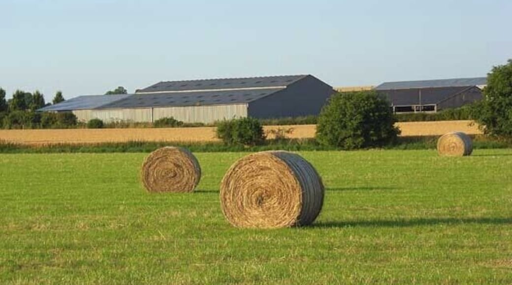 Hay bales and barns, Haxton The buildings are at the crossroads east of the village and viewed from the footpath to the south.