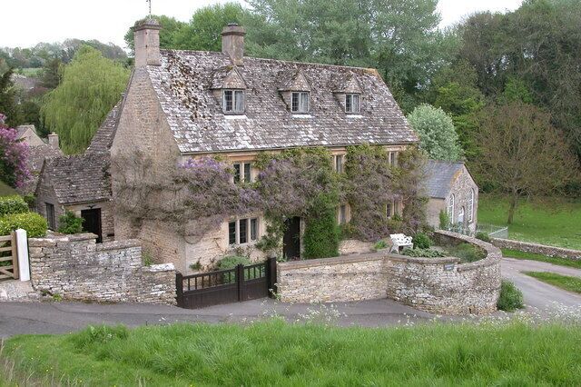 A picturesque Cotswold stone house located by the church in Duntisbourne Abbots.