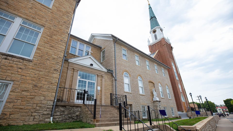 A historic building with a clock tower and a stone facade.
