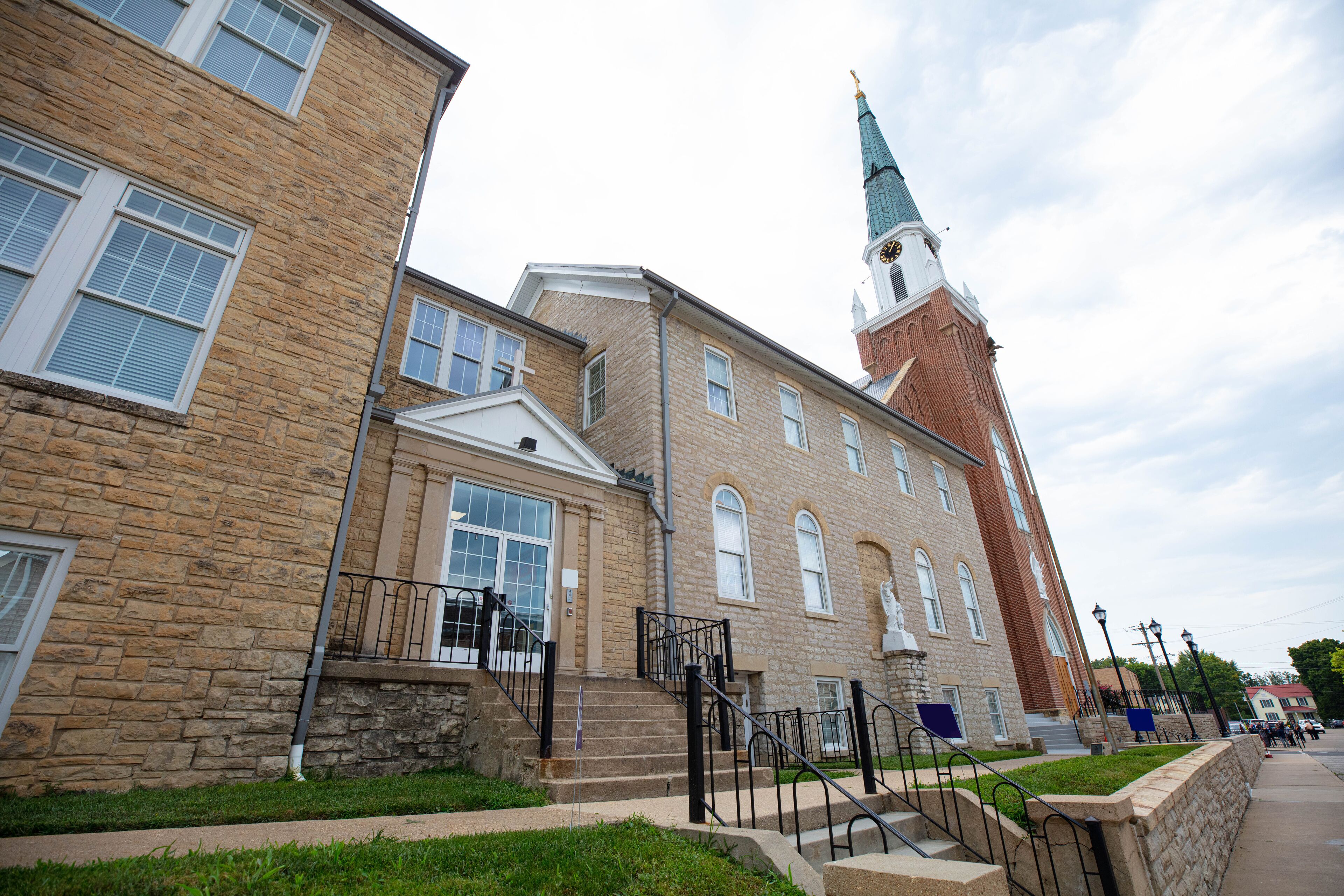 A historic building with a clock tower and a stone facade.
