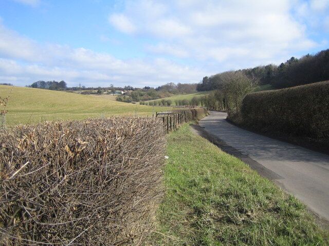 Latimer: Buckinghamshire & Hertfordshire. Viewed looking north along Flaunden Bottom, the county boundary runs down the left side of the lane with Buckinghamshire to the left and Hertfordshire to the right.