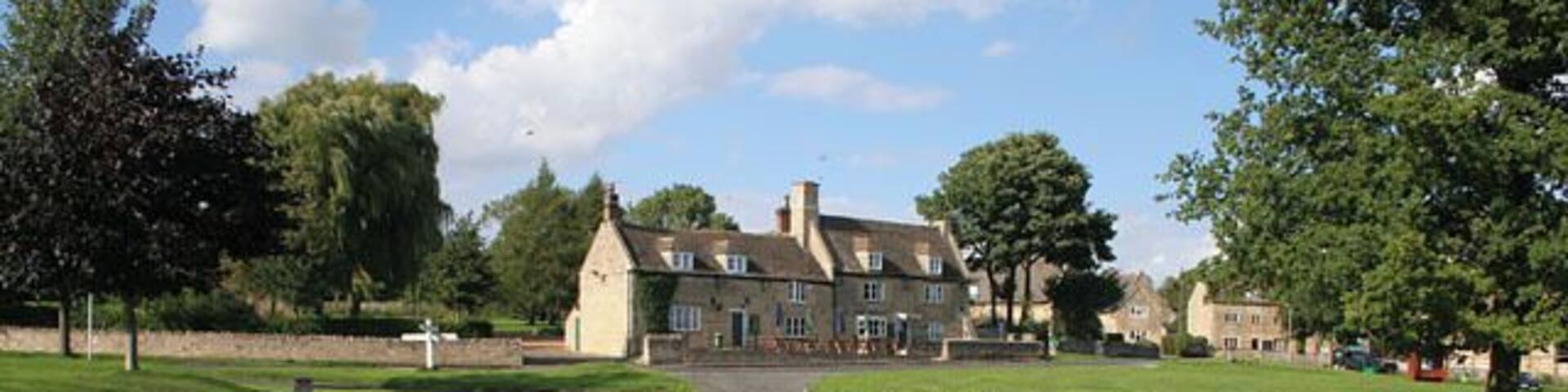 Barrowden, Rutland. Between Uppingham and Peterborough, this quintessential English village boasts a substantial village pond complete with ducks. Unfortunately they were rather shy and were hiding beneath the duck house! The pub on the opposite side of the large village green is the Exeter Arms. The houses are built mainly of limestone, typical of the villages in this area.