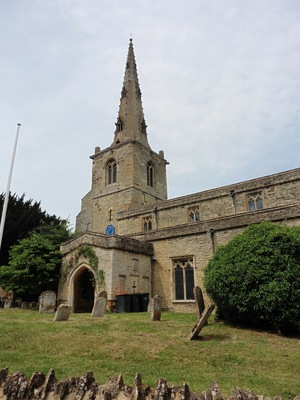 Steeple and south porch of the parish church of St Mary the Virgin, Podington, Bedfordshire, seen from the southeast