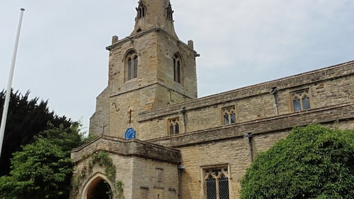Steeple and south porch of the parish church of St Mary the Virgin, Podington, Bedfordshire, seen from the southeast