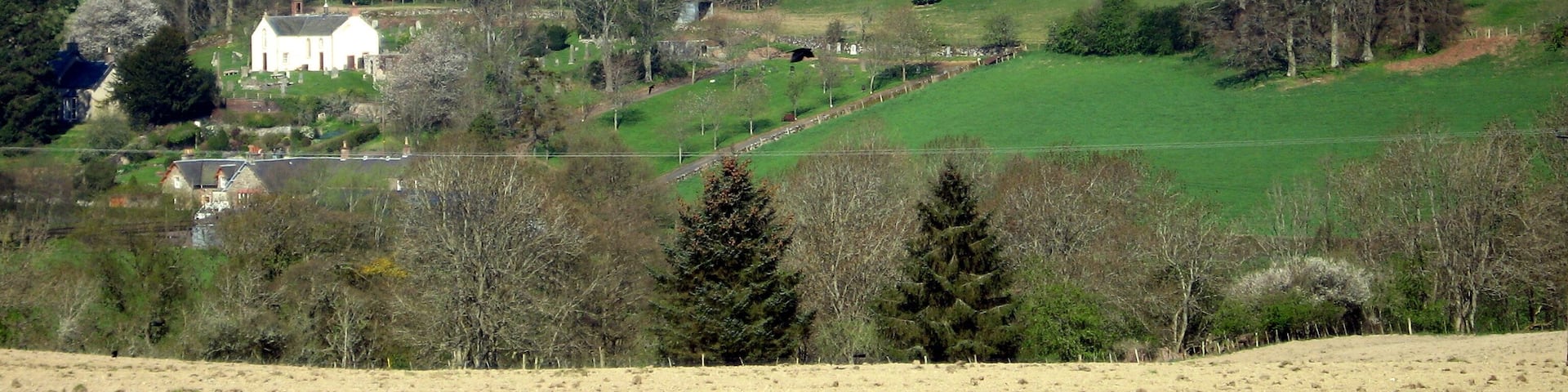 The Woll viewed from the layby on the A7 south of Ashkirk Ale Water flows from left to right in the valley between the bare field in the foreground and The Woll on the hillside beyond. Near Ancrum, it joins the River Teviot, which enters the River Tweed near Kelso.