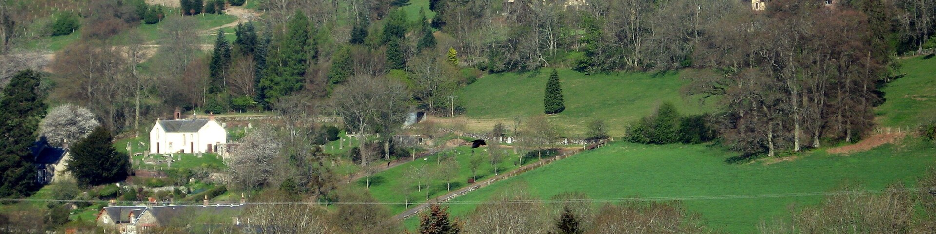 The Woll viewed from the layby on the A7 south of Ashkirk Ale Water flows from left to right in the valley between the bare field in the foreground and The Woll on the hillside beyond. Near Ancrum, it joins the River Teviot, which enters the River Tweed near Kelso.