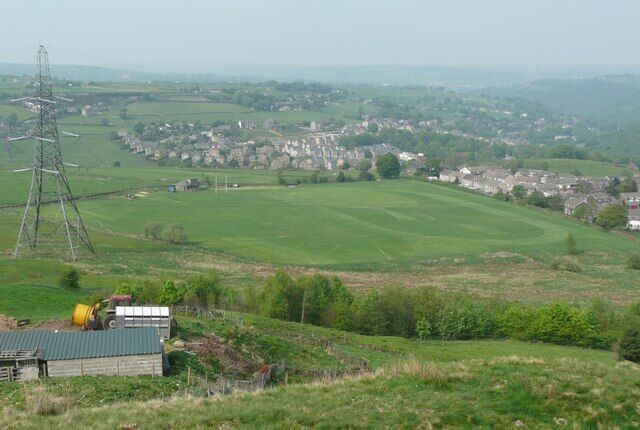 Sports Ground,Rishworth New Road, Rishworth. A grass running track and Rugby goal posts. Also a football ground on the far side of Rishworth New Road.