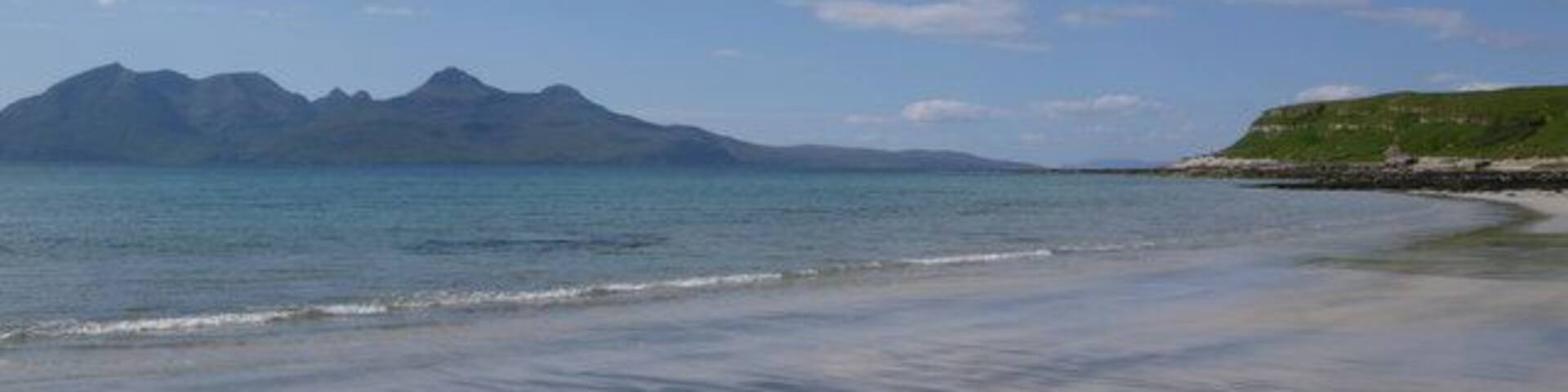 Cleadale Beach Looking to the Island of Rum. The beach had what looked to be streaks of black volcanic sand as well as the obvious white sand