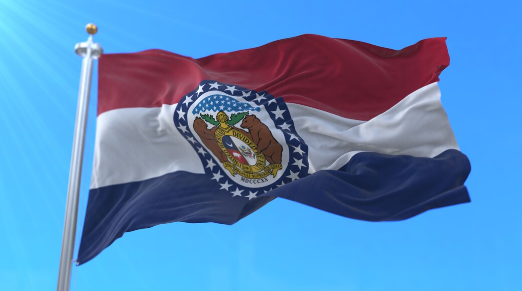 A flag with a coat of arms, red, white, and blue horizontal stripes, and a flagpole.