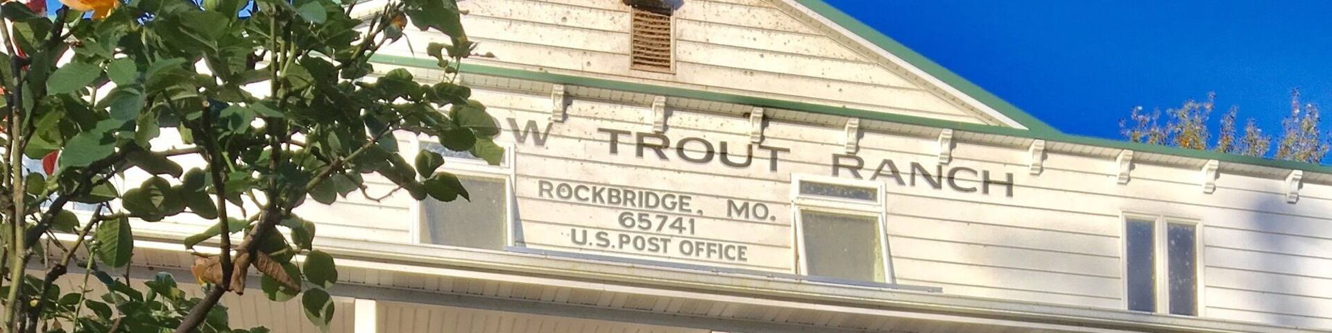 A building labeled "W. Trout Ranch" with a porch and steps leading up to it.