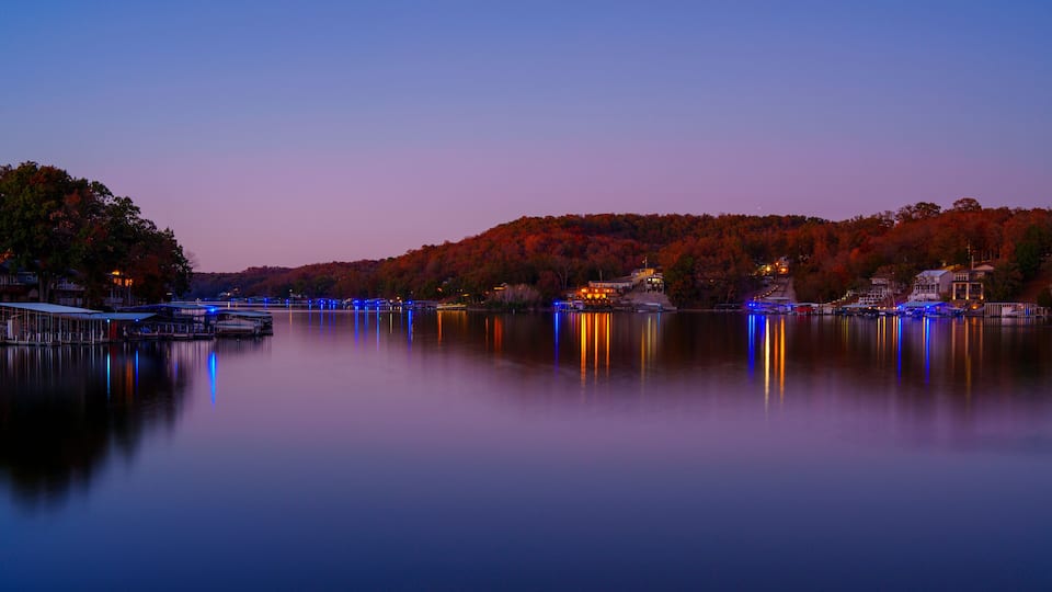 Lake of the Ozarks in Rocky Mount Missouri, USA: A tranquil autumn sunset view with light reflections on the calm water