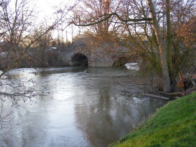 The Lugg in full spate at Moreton Bridge This was taken after days of constant rain. I liked the evening light on the brianches on the right.