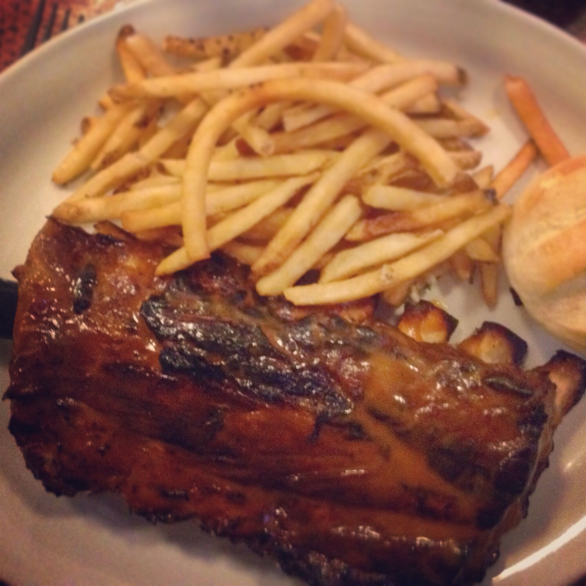 The famous rack of ribs. The secret to this luscious BBQ experience? Honey mustard and coffee in the sauce. #win