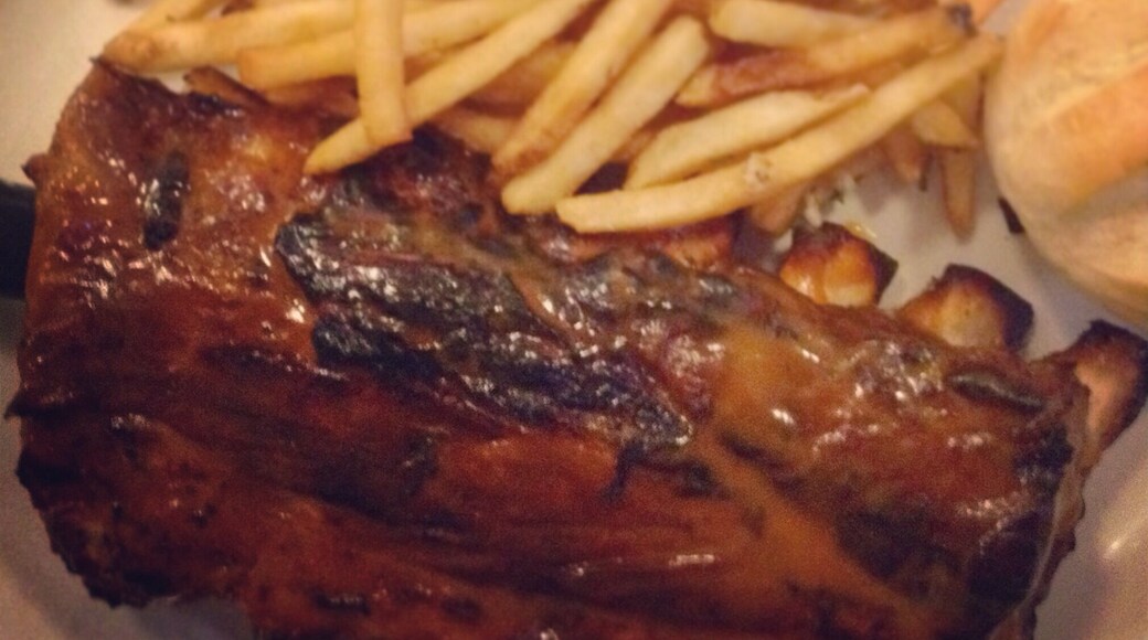 The famous rack of ribs. The secret to this luscious BBQ experience? Honey mustard and coffee in the sauce. #win