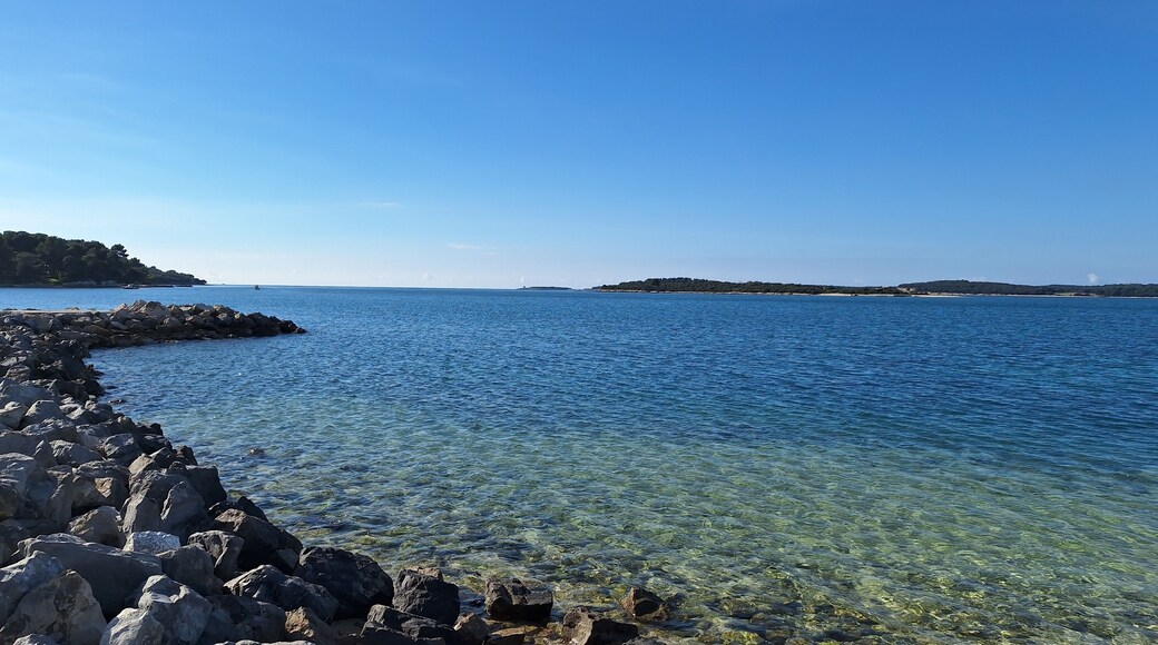 Pula, Croatia - November 3, 2024: Sea close-up. Pebbles on the beach