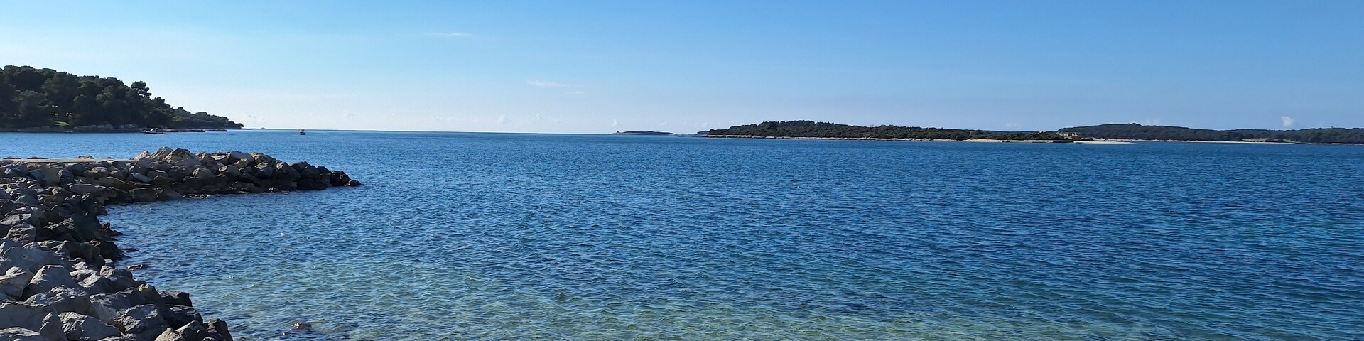 Pula, Croatia - November 3, 2024: Sea close-up. Pebbles on the beach