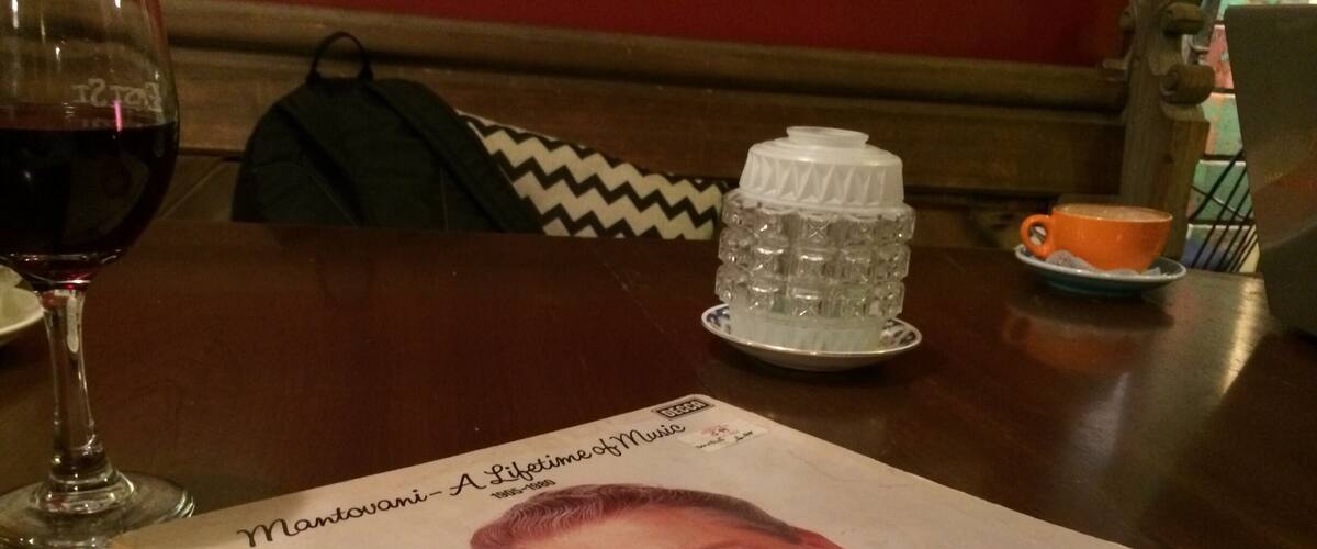A book titled 'Montovani - A Lifetime of Music' on a table.