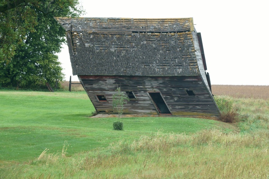 This old barn is still holding on, but the law of gravity is against it!