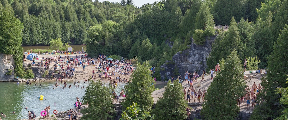People swimming in Elora Quarry conservation area, Ontario, Canada
This two acre former limestone quarry is encircled by sheer cliffs up to 12 m high.